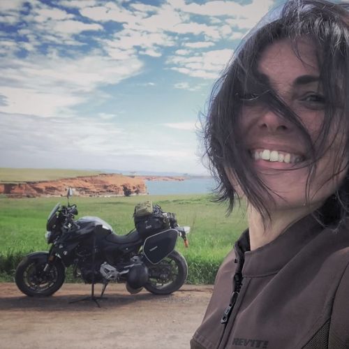 Isabelle, a solo motorcycle traveler and owner of DUSTnROAD